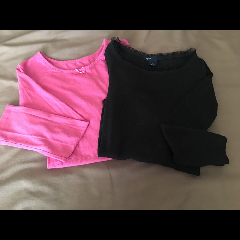 Pair of long sleeve girls shirts